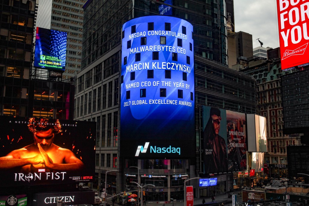 a photo of the Nasdaq in Times Square in New York showing Malwarebytes on the big screens facing the streets