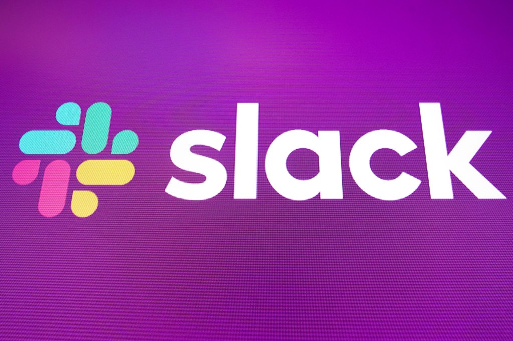 logo for Slack is displayed on the a monitor at the New York Stock Exchange
