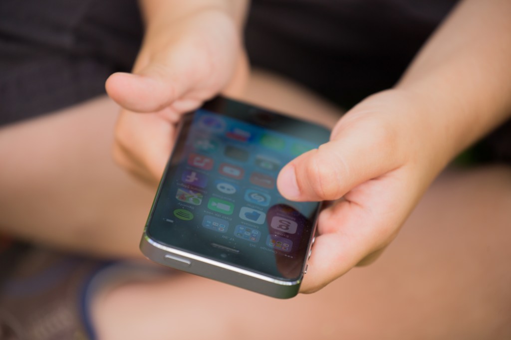 Kid with iPhone