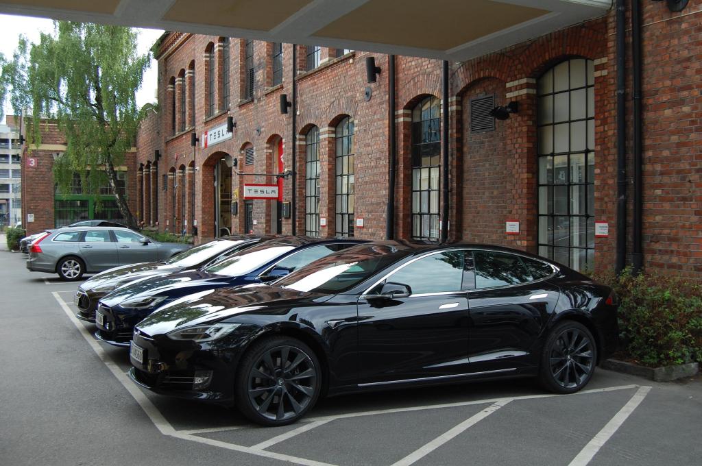A picture taken on July 31, 2018 shows Model S electric cars of Tesla parked outside a service center in Oslo, Norway.