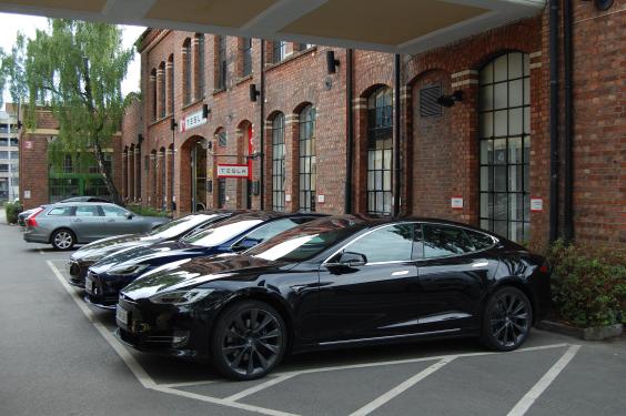 A picture taken on July 31, 2018 shows Model S electric cars of Tesla parked outside a service center in Oslo, Norway.