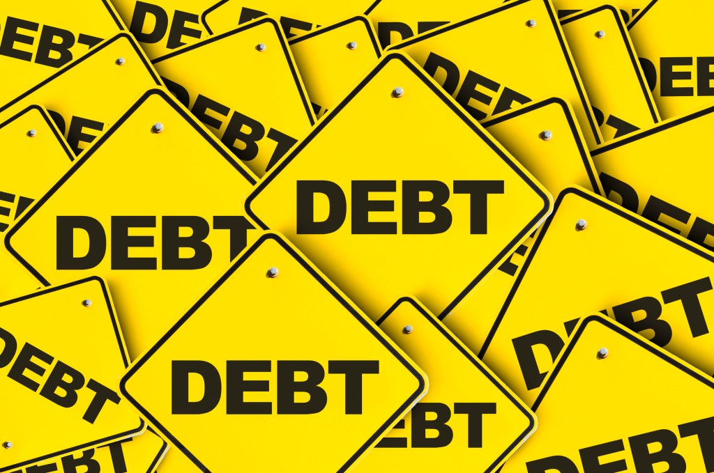 Array of "Debt" road signs