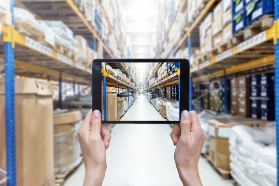 Warehouse of large factory & digital tablet