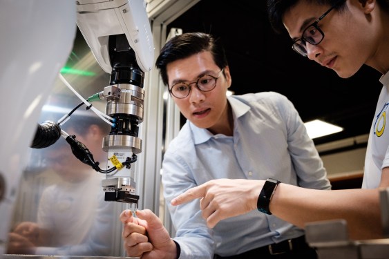 Photo 1 Assoc Prof Pham Quang Cuong working with lead engineer Dr Pham Tien Hung who was his graduate student