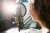 woman speaking into a microphone in a recording studio