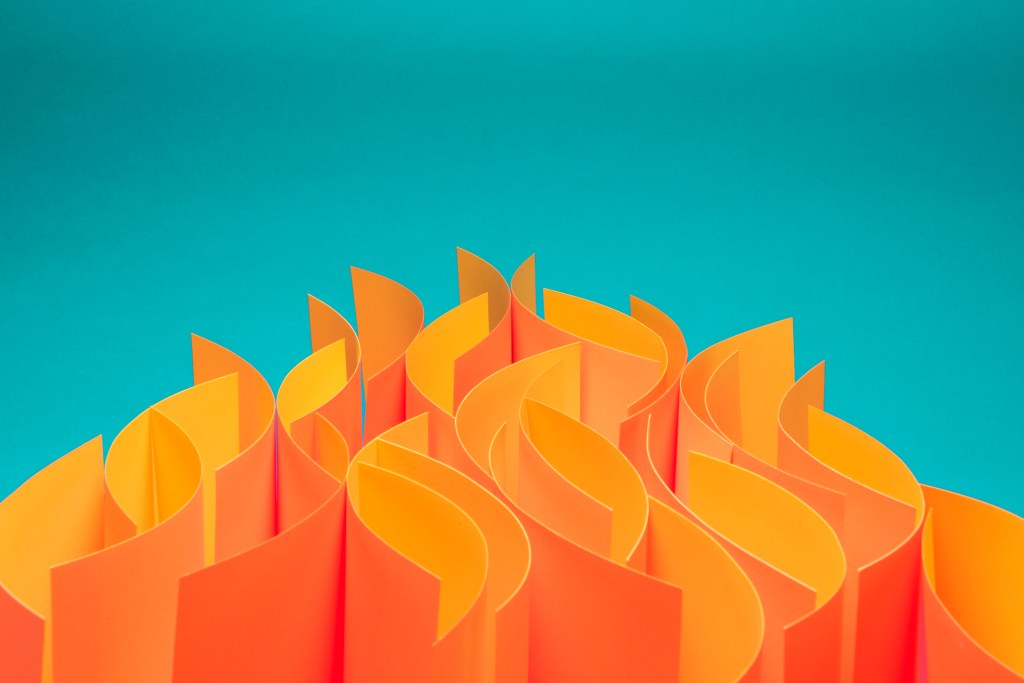 Waves of sheets of paper that mimic fire