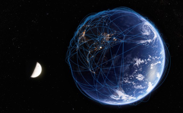 image of earth in the foreground, half moon in the background