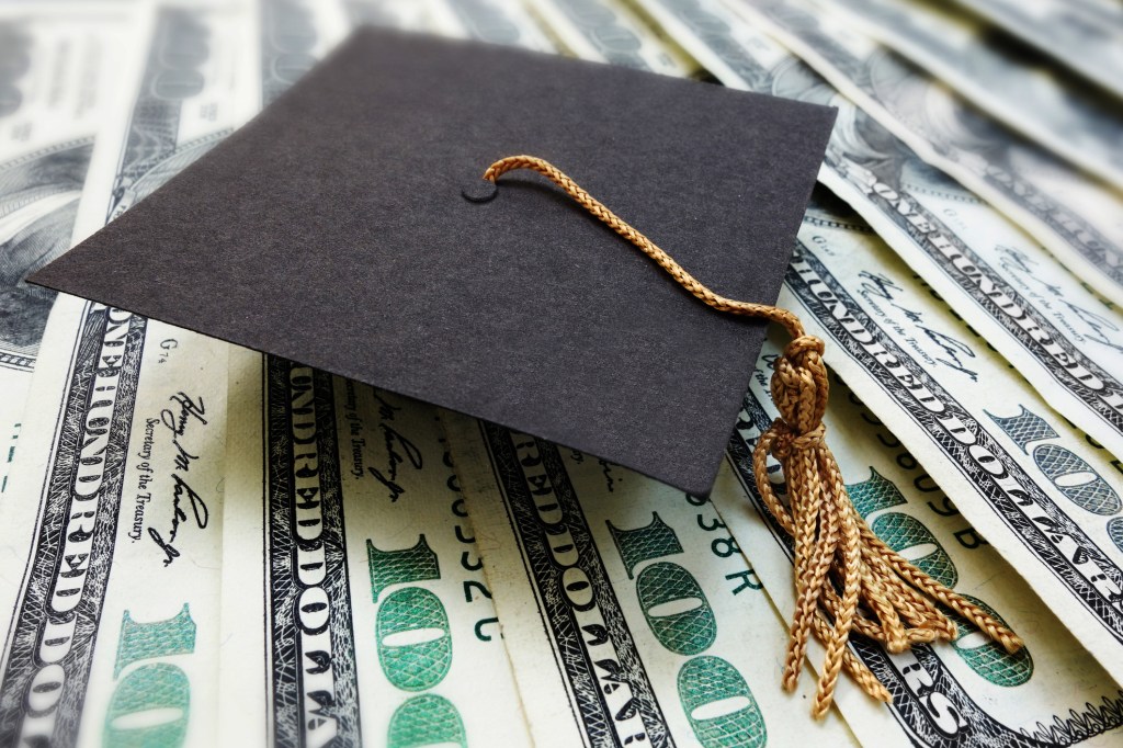 Graduation cap on money