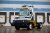 electric yard truck in front of warehouse bay doors