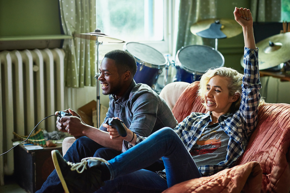 Friends play a games console