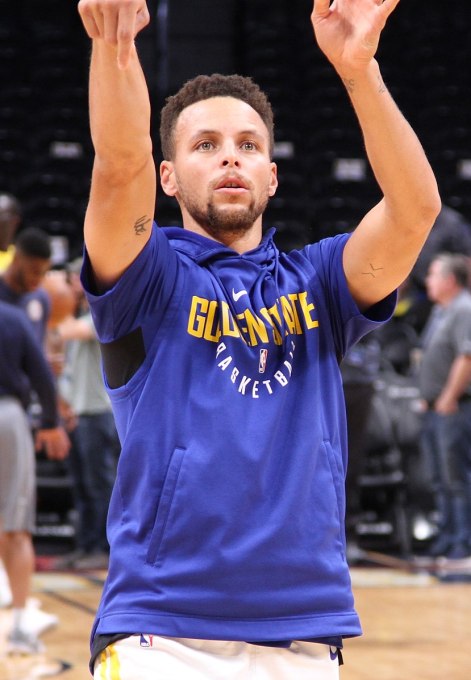 steph curry shoots a basket