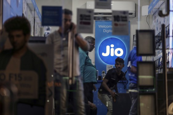 The logo of Reliance Jio, the mobile network of Reliance Industries Ltd., is displayed inside a store in Mumbai, India.