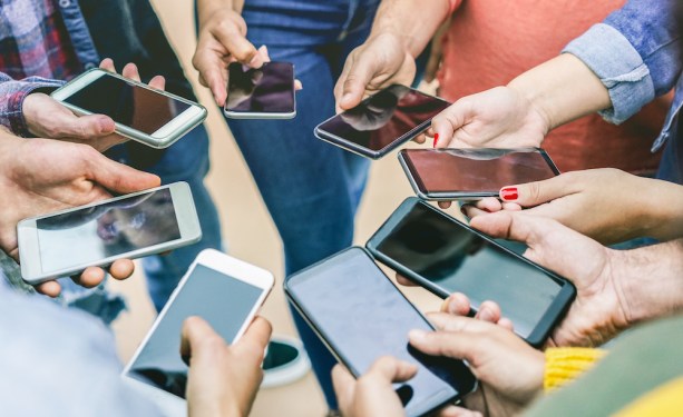 circle of hands using smart mobile phones