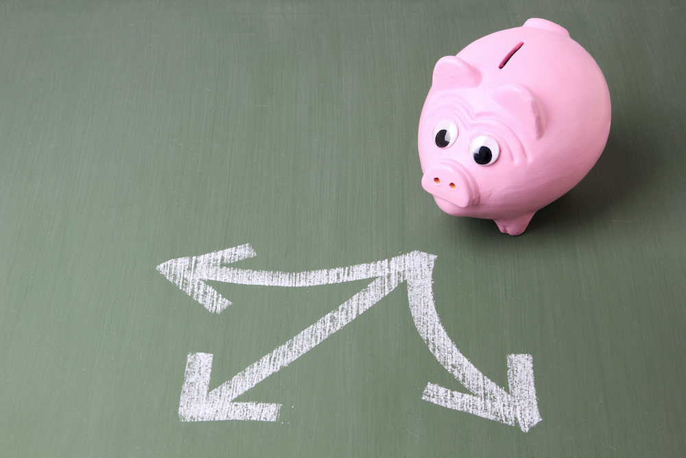 Pink piggy bank standing in front of three arrows showing different directionsSome other related images: