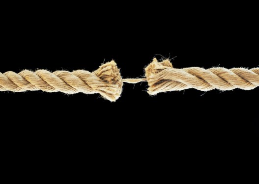 Frayed rope at breaking point, close-up.