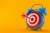 Alarm clock with bull's eye and arrow on the bull's eye