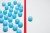 One blue ball on one right side of red line, many blue balls on left side