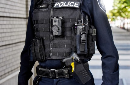 A police officer with body camera and Taser.