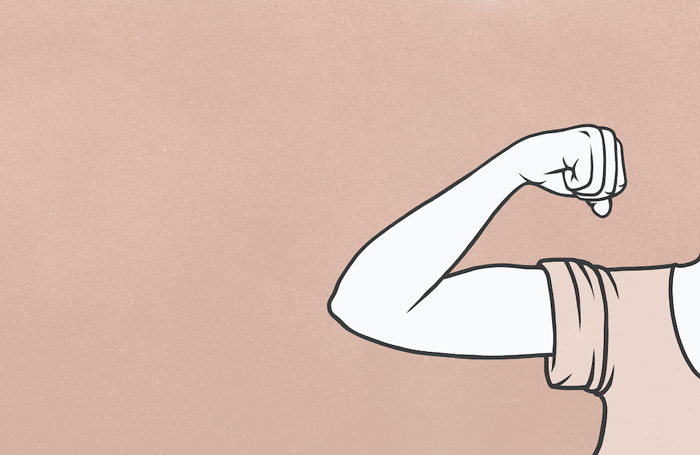 Woman flexing biceps muscle