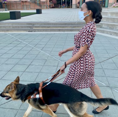 Haben Girma and her guide dog Mylo walking on the sidewalks of downtown Mountain View, CA.