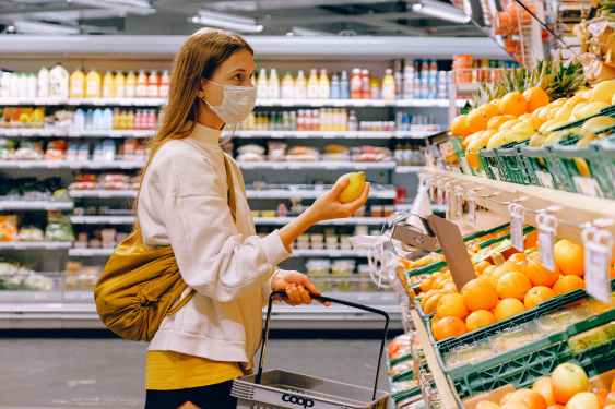 woman shopping for fresh produce in supermarket