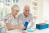 A publicity photo of patients using digital therapeutics startup Biofourmis' Biovitals system