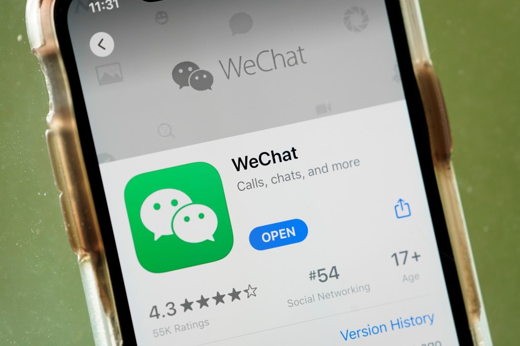 In this photo illustration, the WeChat app is displayed in the App Store on an Apple iPhone.