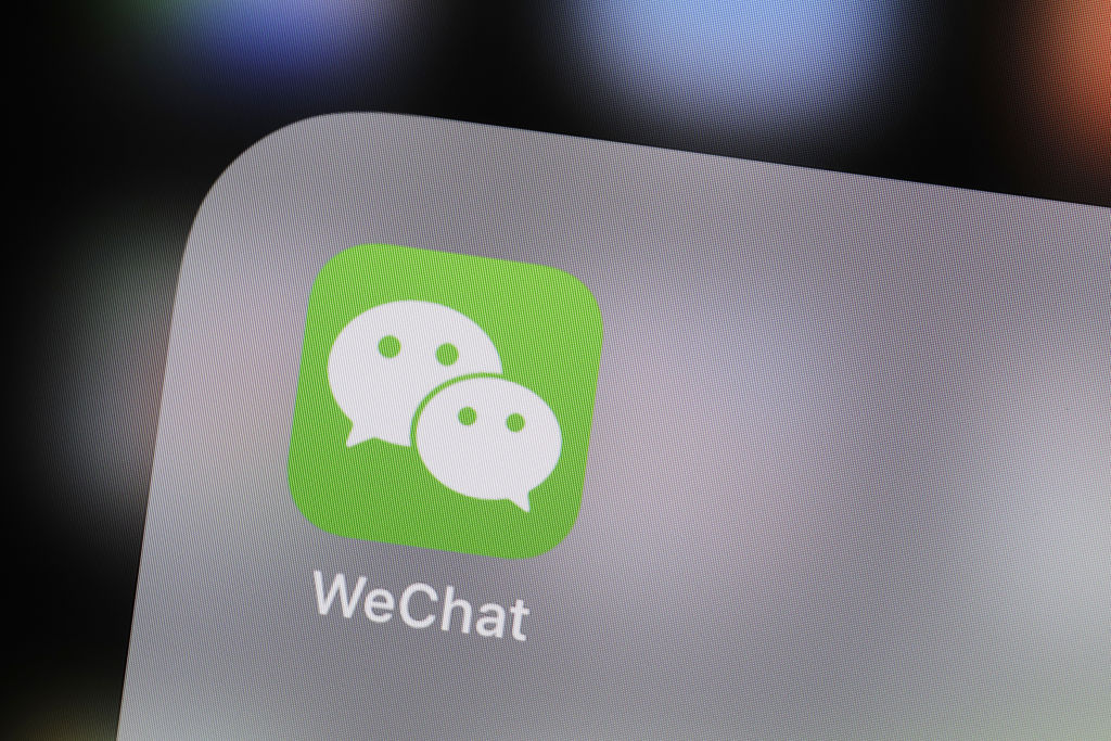 The icon for the Tencent Holdings Ltd. WeChat messaging application is seen in this arranged photograph taken in Hong Kong, China, on Thursday, Oct. 12, 2017. Regulators elsewhere may be clamping down on the financial industry's use of private messaging apps, but in China the practice is flourishing. Players in the country's $11 trillion bond market use personal accounts on WeChat and QQ for everything from distributing research to soliciting orders. Photographer: Justin Chin/Bloomberg via Getty Images