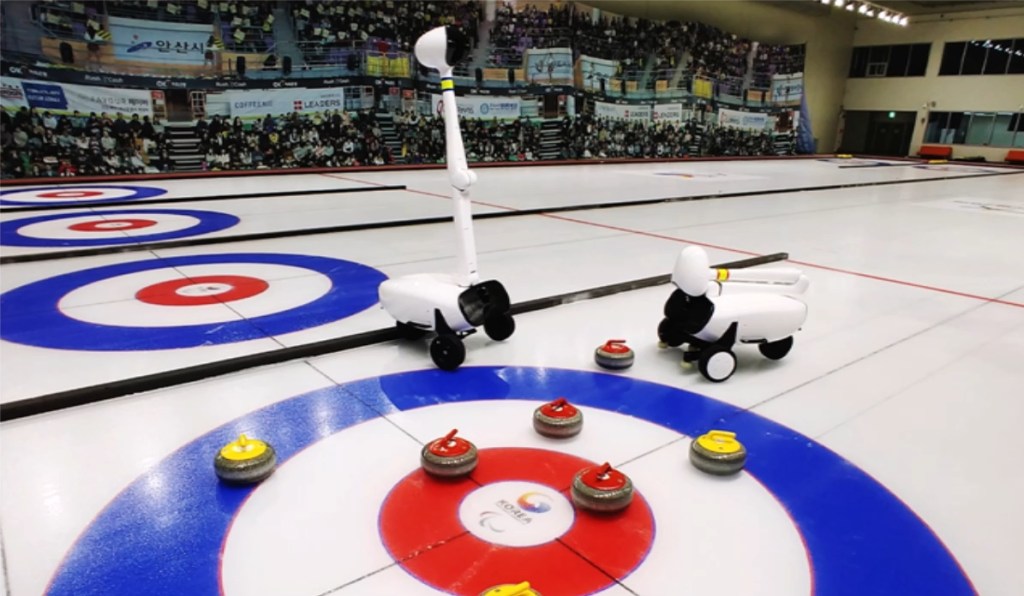 The Curly curling robot on the ice.