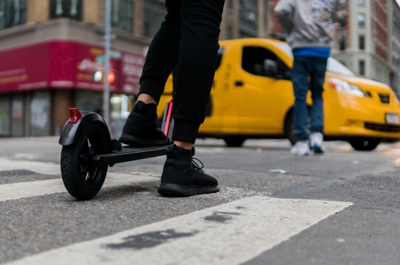 Electric scooter and yellow cab