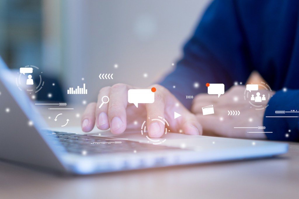 close up on man hand holding smartphone with futuristic of social media marketing icon for internet network technology and business concept