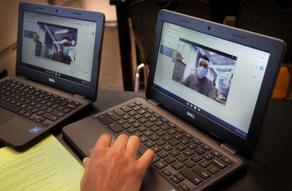 BOSTON, MA - AUGUST 21: Operations assistant Nick Alves checks the cameras while preparing Chromebook for students in the technology department at Boston Preparatory Charter School in Boston, MA on August 21, 2020. Boston's independently run charter schools are planning to start the school year remotely, although most intend to offer in-person learning for small groups of high needs students. (Photo by Craig F. Walker/The Boston Globe via Getty Images)