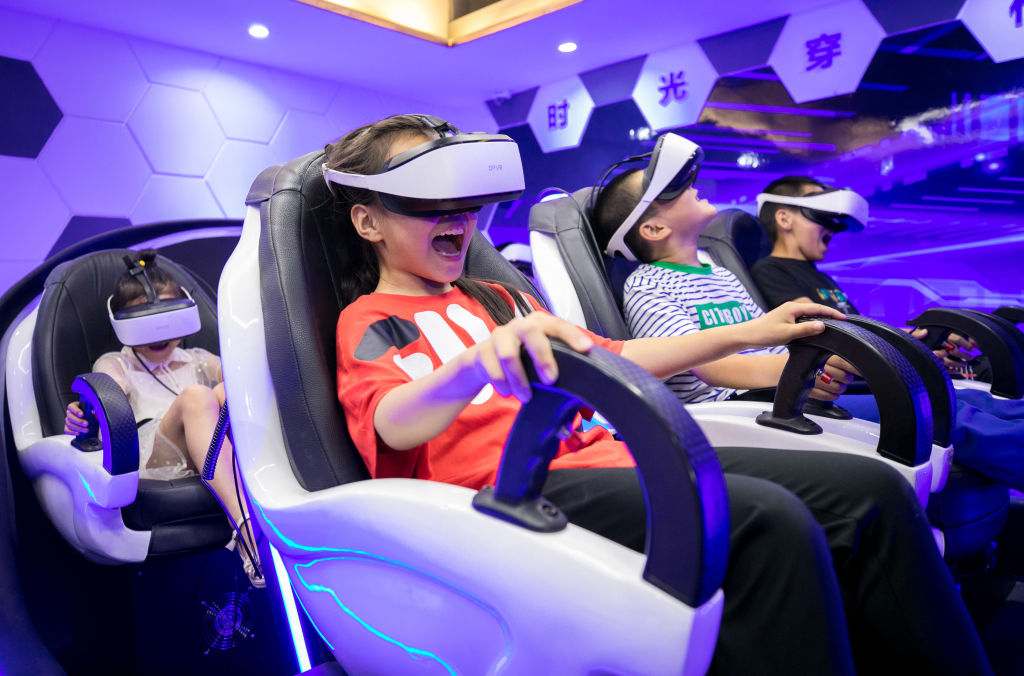 HOHHOT, CHINA - JULY 22: Children wearing VR headsets watch videos at a science and technology museum during their summer vacation on July 22, 2020 in Hohhot, Inner Mongolia Autonomous Region of China. (Photo by Ding Genhou/VCG via Getty Images)