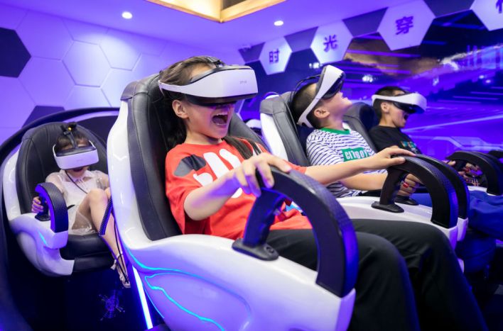 HOHHOT, CHINA - JULY 22: Children wearing VR headsets watch videos at a science and technology museum during their summer vacation on July 22, 2020 in Hohhot, Inner Mongolia Autonomous Region of China. (Photo by Ding Genhou/VCG via Getty Images)