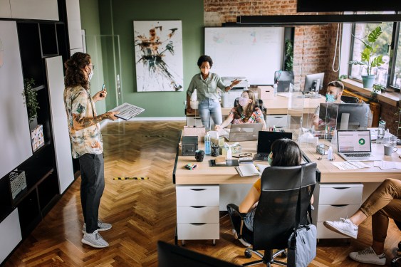 Meeting in the new office setup with employees distanced
