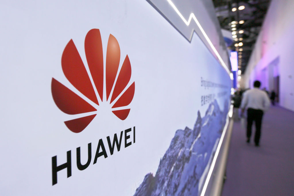 BEIJING, CHINA - OCTOBER 15: People visit the Huawei stand during PT Expo China (PTEXPO) at China National Convention Center on October 15, 2020 in Beijing, China. (Photo by VCG/VCG via Getty Images)