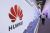 BEIJING, CHINA - OCTOBER 15: People visit the Huawei stand during PT Expo China (PTEXPO) at China National Convention Center on October 15, 2020 in Beijing, China. (Photo by VCG/VCG via Getty Images)