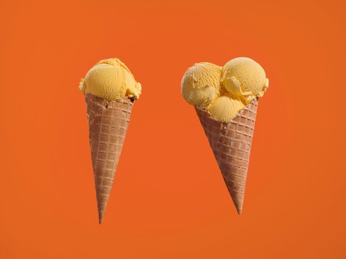 Two ice creams, with one and three scoops