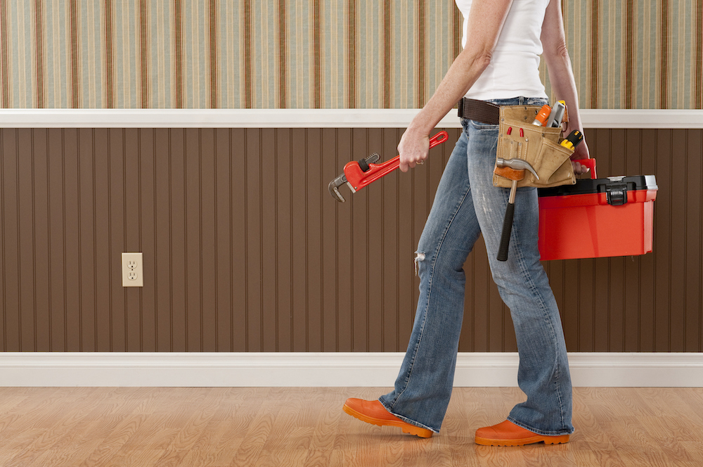 Handywoman Working In Empty Room