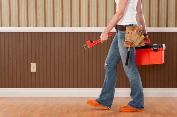 Handywoman Working In Empty Room
