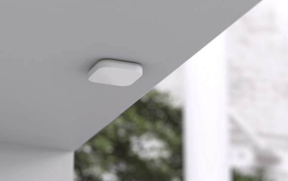 The Density Open Area sensor attached to a ceiling.