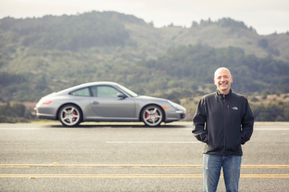 Andre Haddad, CEO at Turo in front of sporty silver car