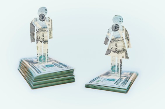 Male and Female Cut-out Figures on top of Bundles of Twenty USD United States Dollar Notes / Bills. Pile of Notes under Female Figure lower than that for the Male Figure.