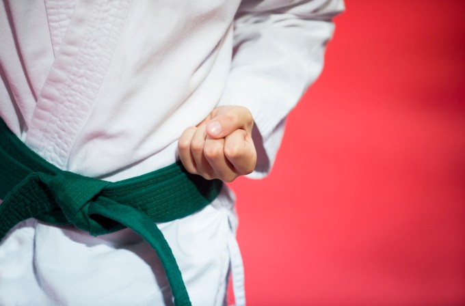 A karate kid with green belt