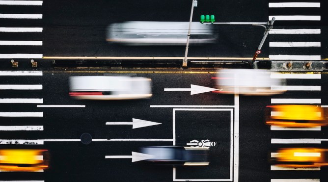 Blurred traffic in an intersection downtown in Taipei Taiwan.