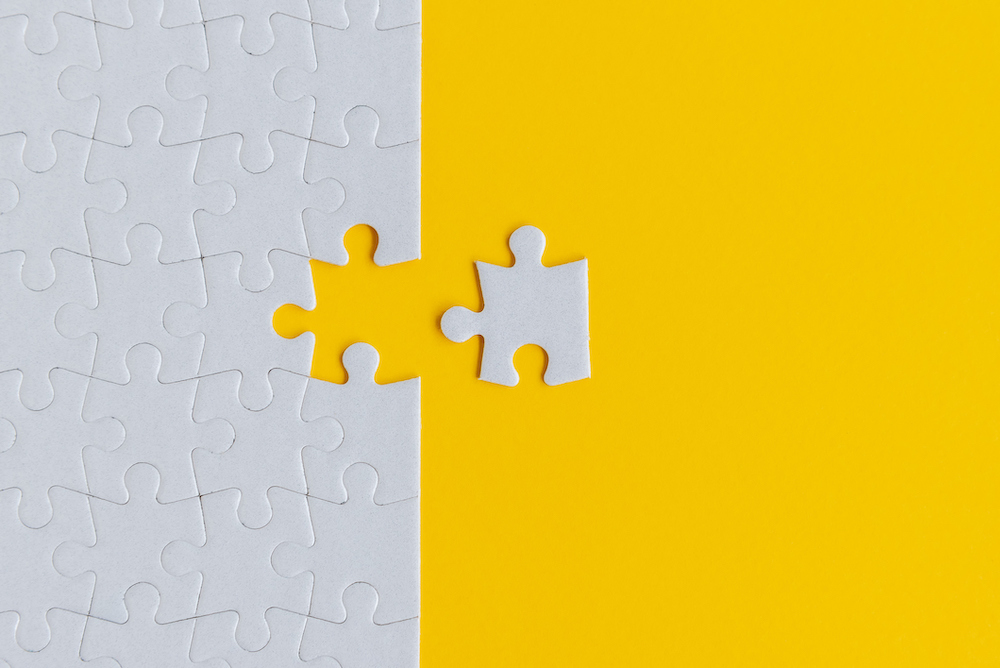 Jigsaw Puzzle on Yellow Background