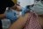 A health care worker injects the a syringe of the phase 3 vaccine trial, to a volunteer at the Ankara University Ibni Sina Hospital in Ankara, Turkey