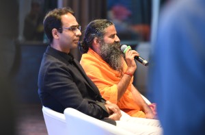 Karan Bajaj, Senior VP& GM, Discovery Communications India with Swami Baba Ramdev during a press conference