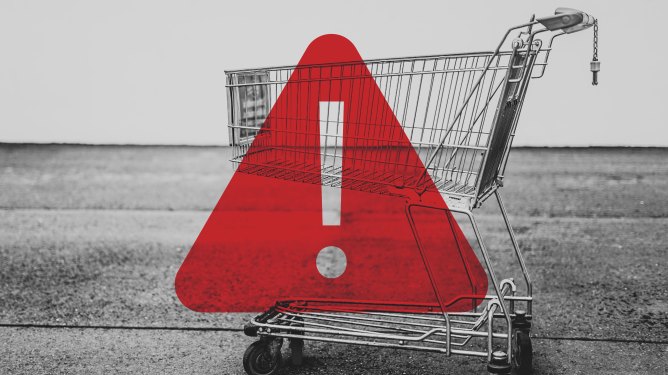 shopping cart with transparent warning symbol