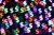 Multi Colored Bling Bling Dollar Sign Shape Bokeh Backdrop on Dark Background, Finance Concept.